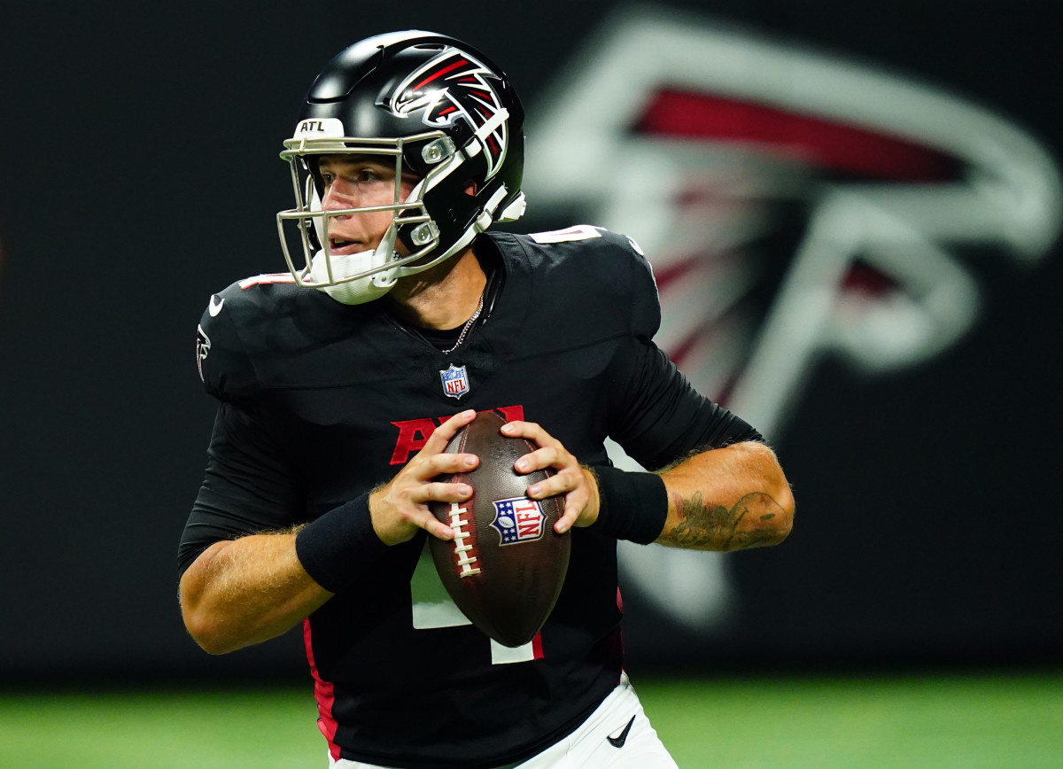 Aug 18, 2023; Atlanta, Georgia, USA; Atlanta Falcons quarterback Taylor Heinicke (4) rolls out to pass against the Cincinnati Bengals during the third quarter at Mercedes-Benz Stadium.